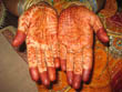 jaipur tour, ladies apply henna or mehandi on their palms on rakhi festival