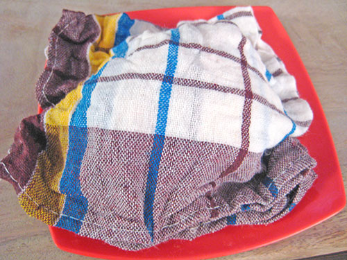 Covered dough with damp cloth