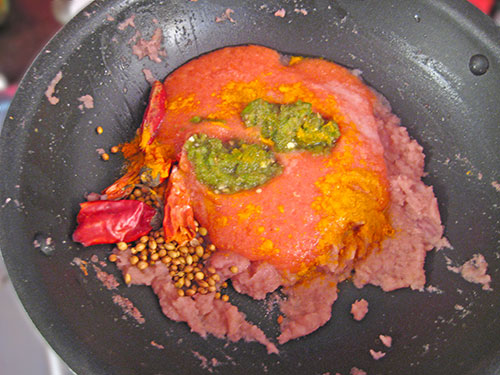Adding of tomato puree and other spices