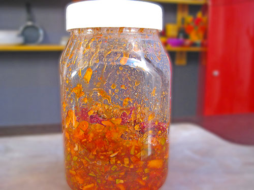 Filled chutney in a jar for keeping in sunlight