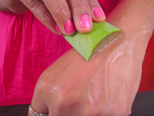 Applying aloe vera on skin