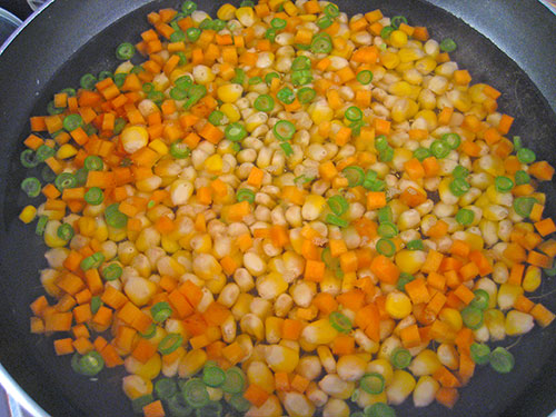 Adding of boiled sweet corn