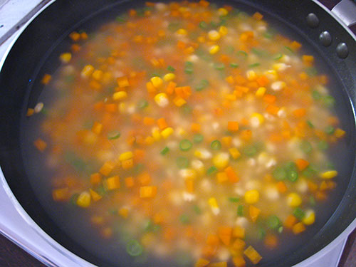 Adding of corn flour solution into soup